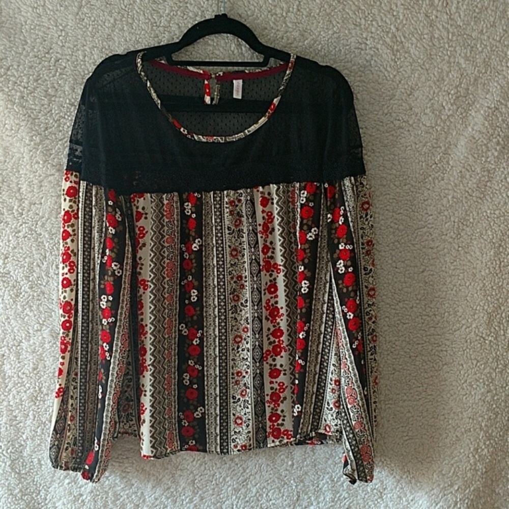 Black lace with red flowers on cream blouse.